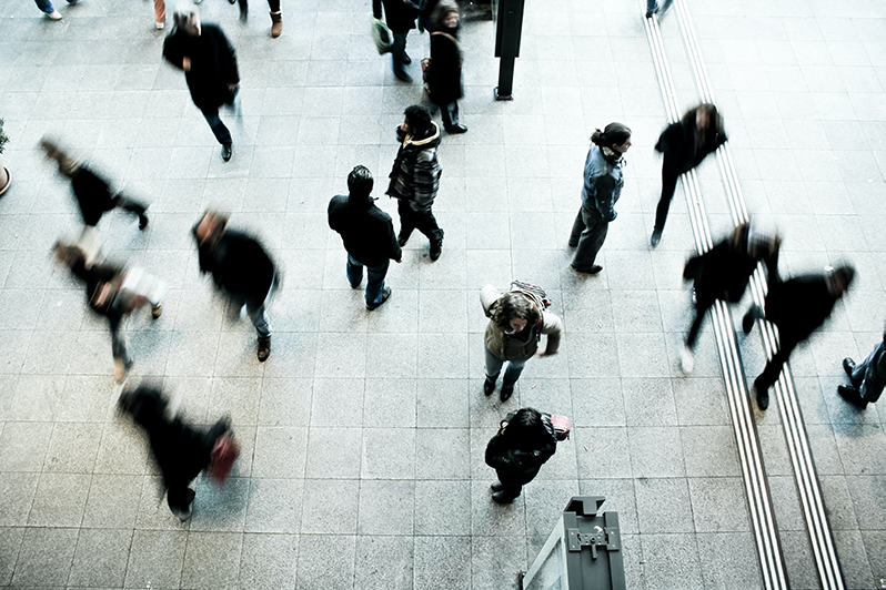 A top view of a busy city street with pedestrians | Business Savers