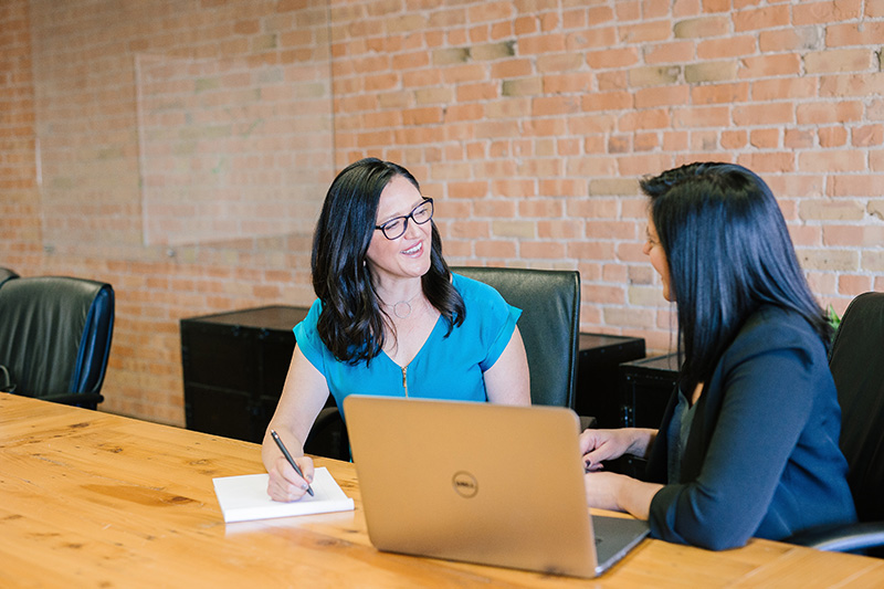 Two women in a business meeting | Business Savers